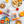 Assorted breakfast items including Dam Good English Muffins, fruit, and spreads on a white surface.