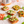 Small Dam Good English Muffin pizzas with various toppings on a white surface